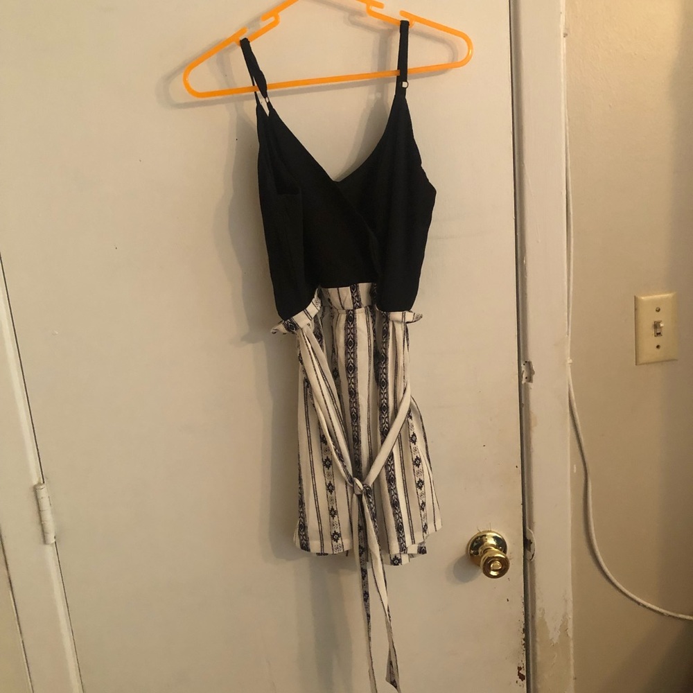 A Lily Rose, size XS, black and white romper with tie.